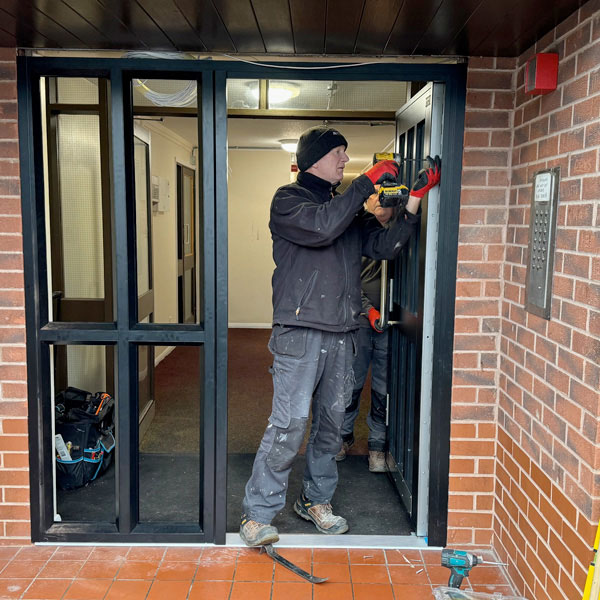 Installing new door at Wrexham business